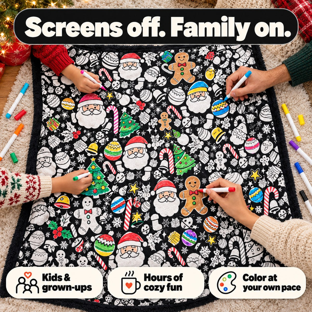 Family hands coloring the blanket together on the floor